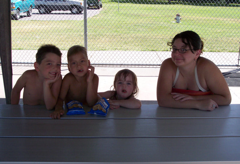 Grand-kids and Tara at Haysville swimming pool. Date unknown.